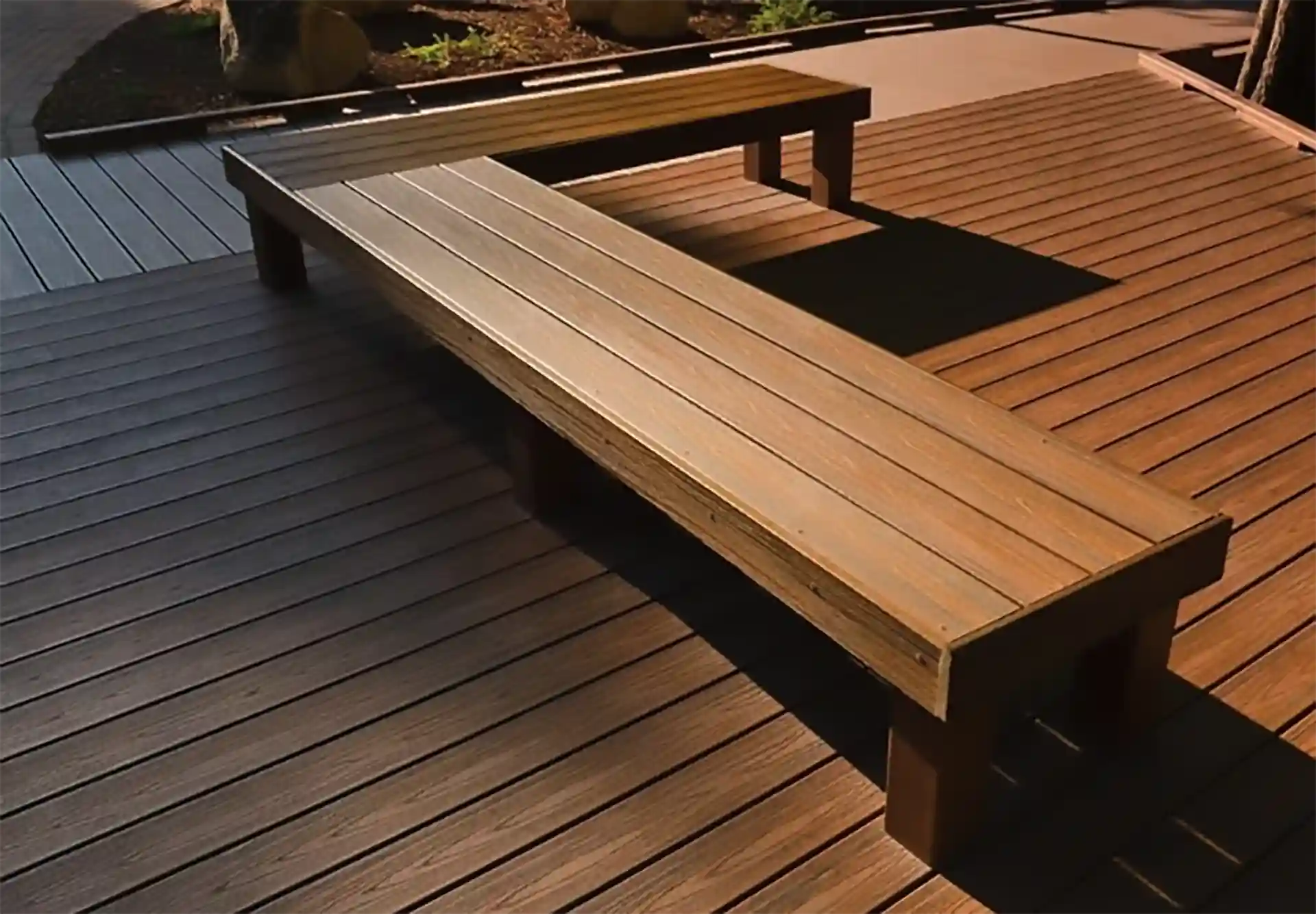 Trex composite deck with built-in bench seating.